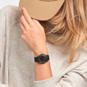 “Golden Tac” Swatch Black and Gold Analog Watch